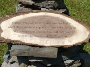 A woodburned sign bidding druids to enter a sacred space