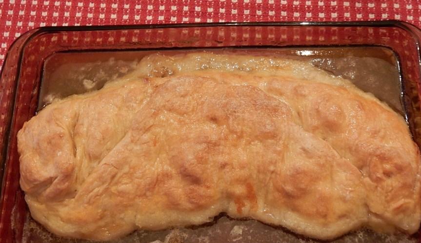 Baked apple roll in baking dish