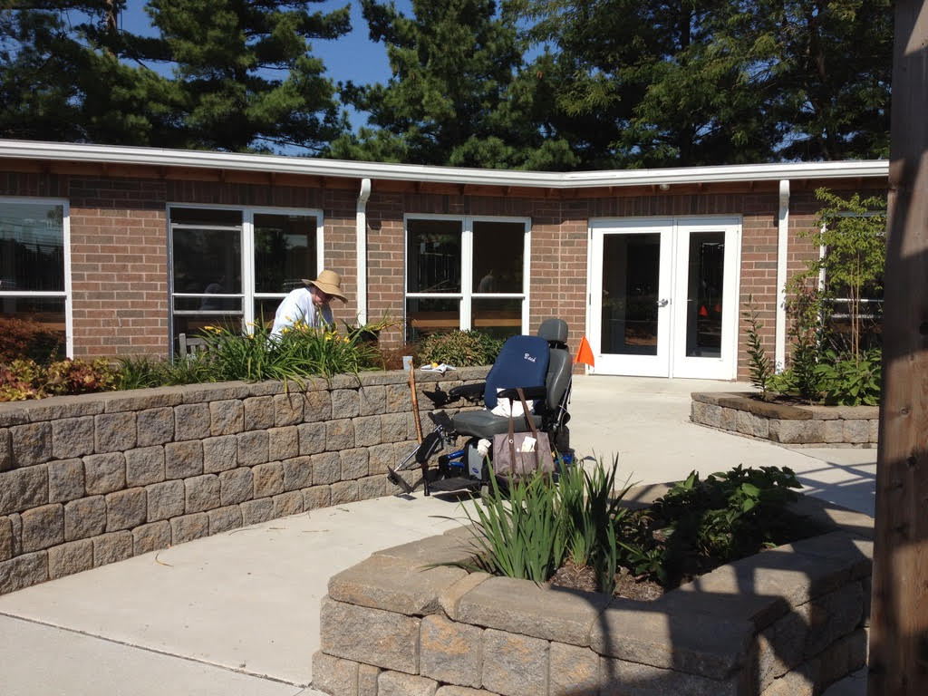 Gardening in a raised bed as part of horticultural therapy