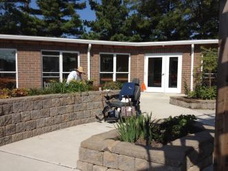 Gardening in a raised bed as part of horticultural therapy